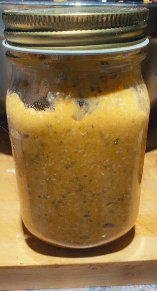 Prepared pumpkin pie overnight oats in a mason jar.